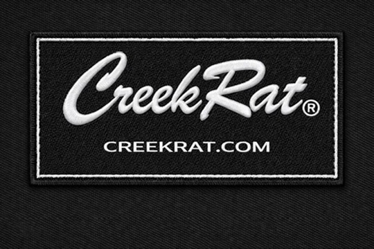 White CreekRat embroidered label with black script logo